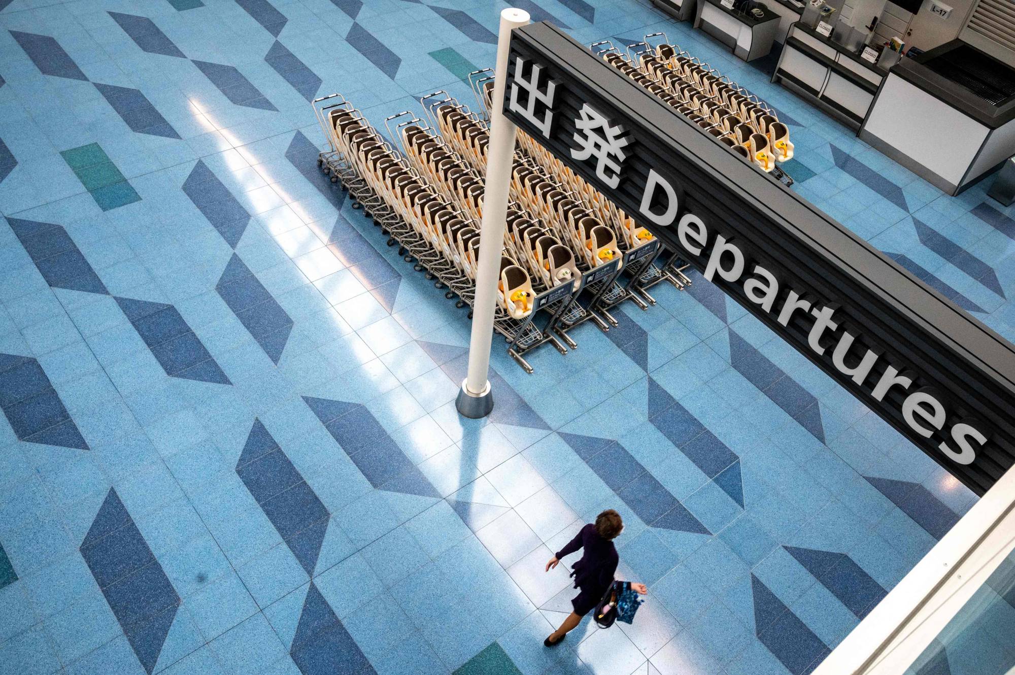 An empty departures hall at Tokyo's Haneda Airport on Jan. 25. As many as 147,000 international students are stuck outside the country, according to government data. | AFP-JIJI