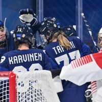 Finland\'s Susanna Tapani celebrates with her teammates after scoring the team\'s sixth goal against Japan netminder Nana Fujimoto on Saturday in Beijing.  | AFP-JIJI