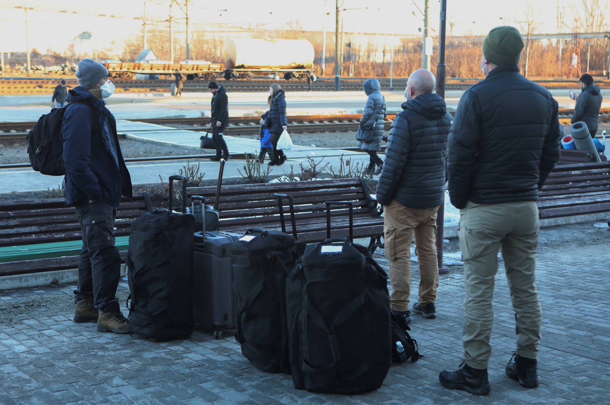 People including members of the OSCE gather at a railway station to board a train to Kyiv while leaving the town of Kramatorsk in Ukraine's eastern Donetsk region on Sunday. | REUTERS