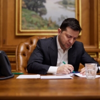 Ukrainian President Volodymyr Zelenskiy listens during a call with U.S. President Joe Biden in Kyiv on Sunday. | UKRAINIAN PRESIDENTIAL PRESS SERVICE / VIA REUTERS