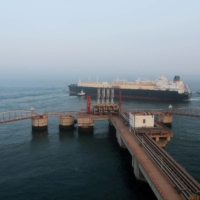 A liquefied natural gas tanker leaves the dock after discharge at PetroChina\'s receiving terminal in Dalian, China, in July 2018. | REUTERS