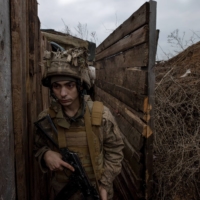 A Ukrainian soldier is stationed in Zaitseve, near territory held by Russian-backed separatists, on Friday. As the threat of a new Russian invasion of Ukraine grew, Finland President Sauli Niinisto, the European head of state with the longest and deepest experience dealing with Vladimir Putin fielded calls and doled out advice to world leaders desperate for insight into his difficult neighbor to the east.  | TYLER HICKS/THE NEW YORK TIMES