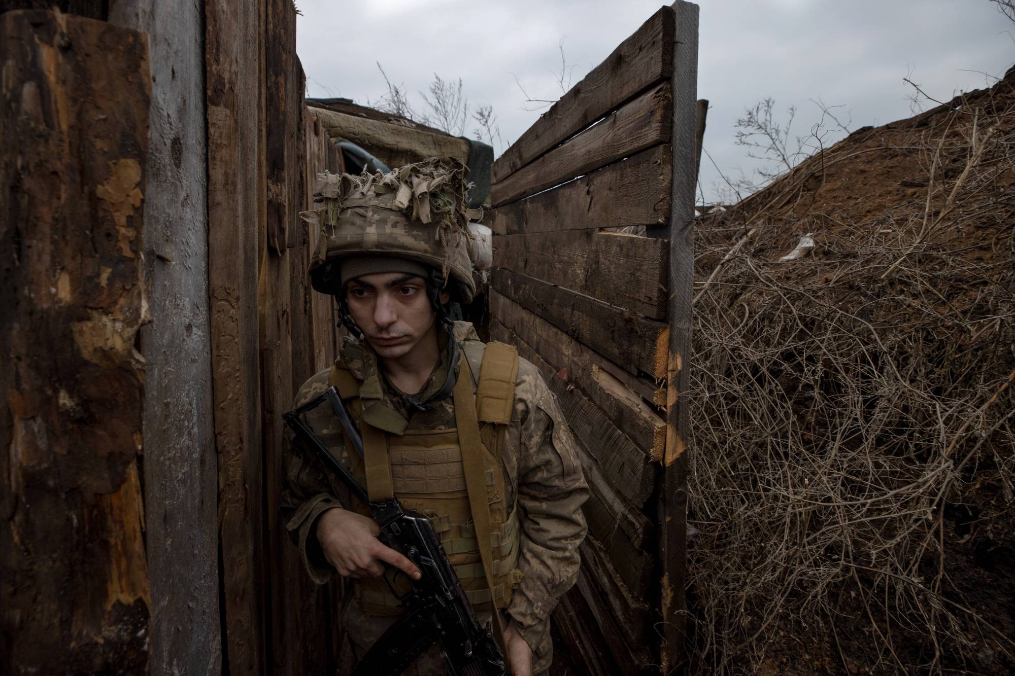 A Ukrainian soldier is stationed in Zaitseve, near territory held by Russian-backed separatists, on Friday. As the threat of a new Russian invasion of Ukraine grew, Finland President Sauli Niinisto, the European head of state with the longest and deepest experience dealing with Vladimir Putin fielded calls and doled out advice to world leaders desperate for insight into his difficult neighbor to the east. | Tyler Hicks/The New York Times