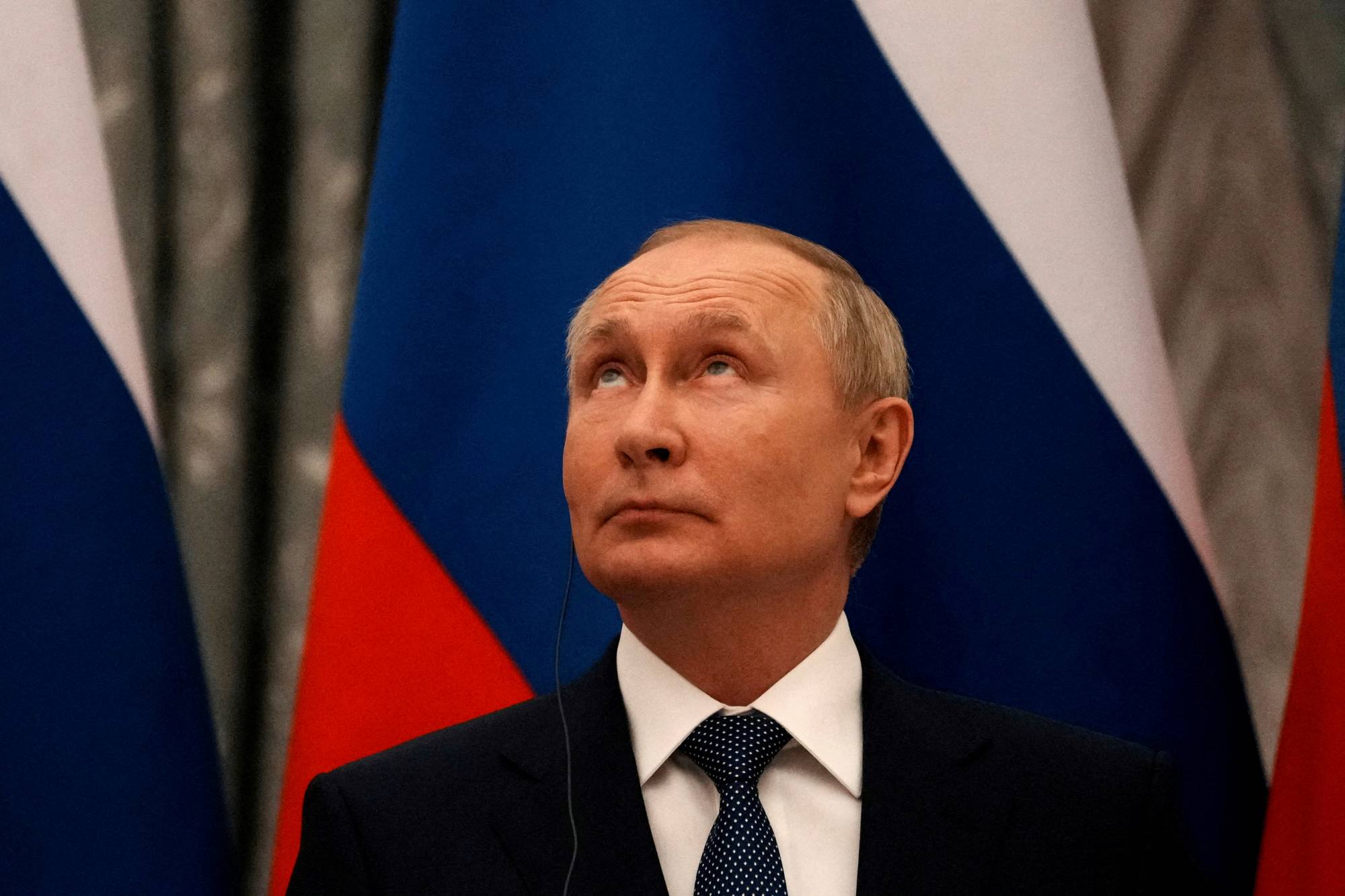Russian President Vladimir Putin looks up during a joint news conference with French leader Emmanuel Macron after their talks in Moscow on Feb. 7. | Pool / via REUTERS