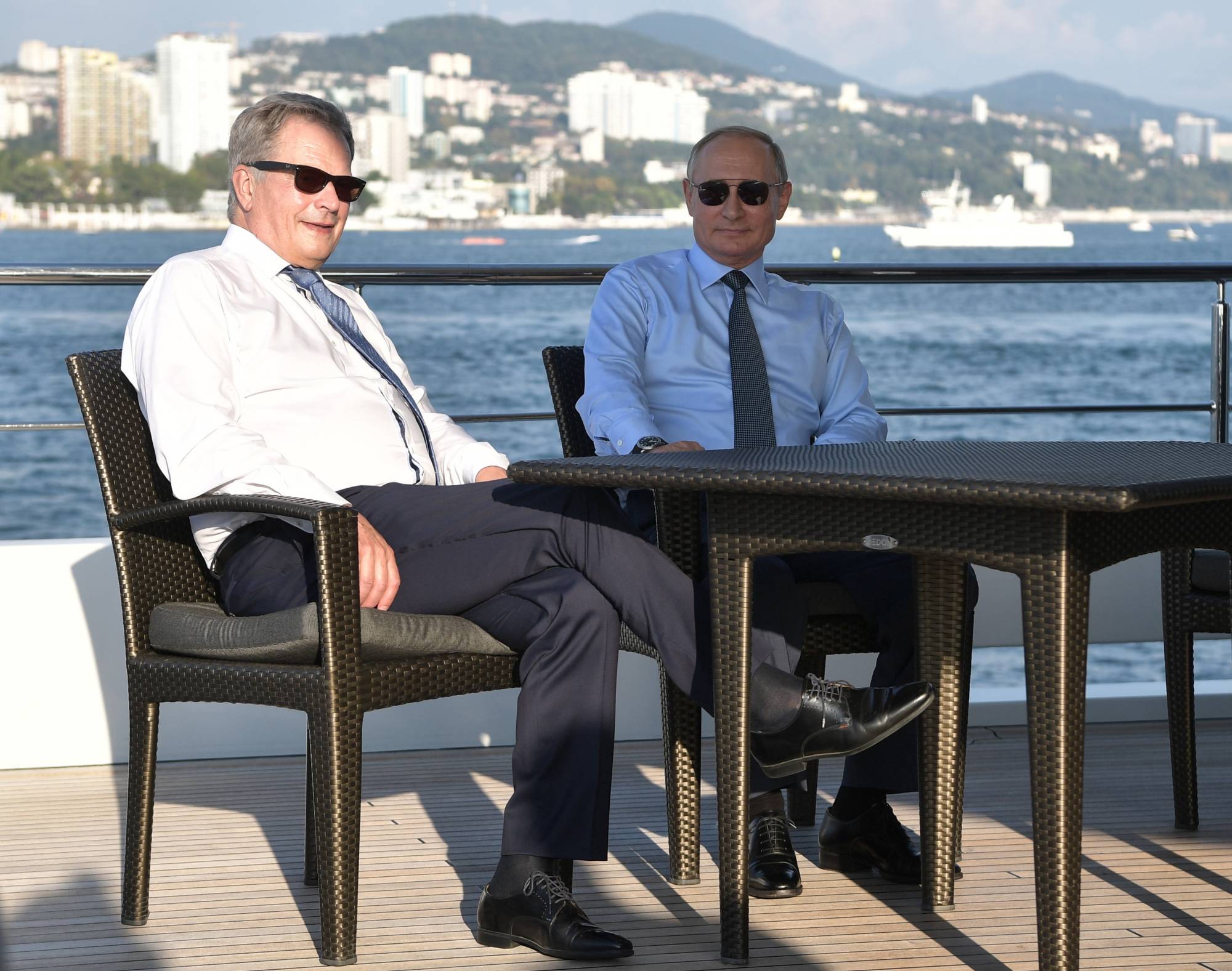 Finnish President Sauli Niinisto and Russian leader Vladimir Putin are seen on a boat following their meeting in the Black Sea resort of Sochi, Russia, in August 2018. |  SPUTNIK / KREMLIN / VIA REUTERS