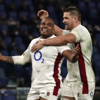 England\'s Kyle Sinckler (left) celebrates after scoring England\'s fifth try against Italy in Rome on Sunday. | REUTERS