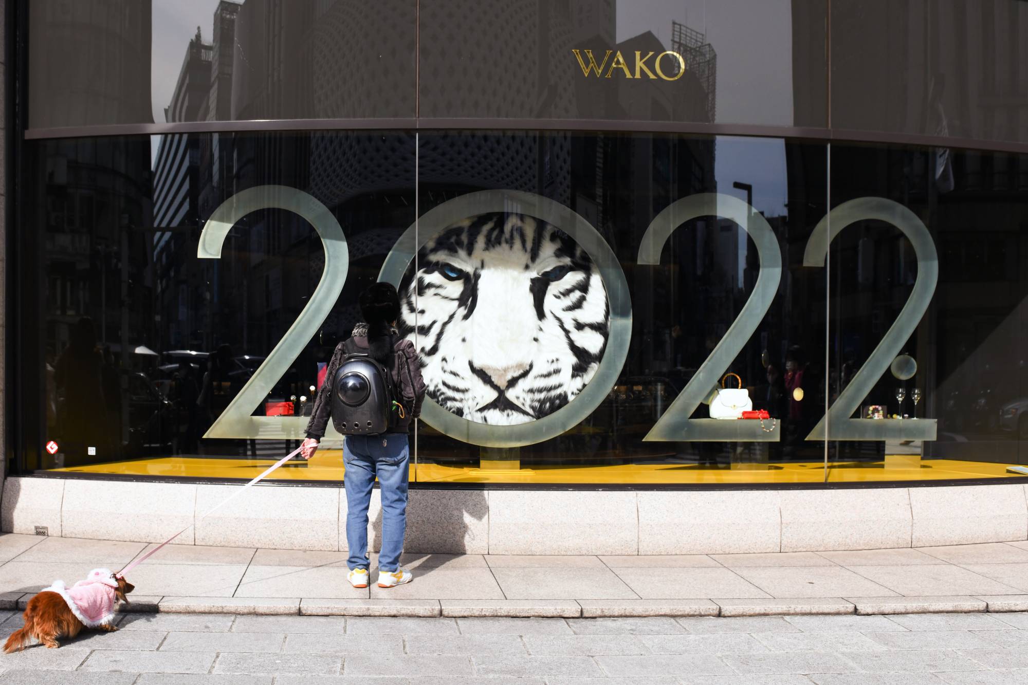 A shop in Tokyo's upscale Ginza district on Saturday. Compared with the fifth wave of the pandemic, the latest wave has seen more deaths but fewer patients in need of critical care. | Bloomberg
