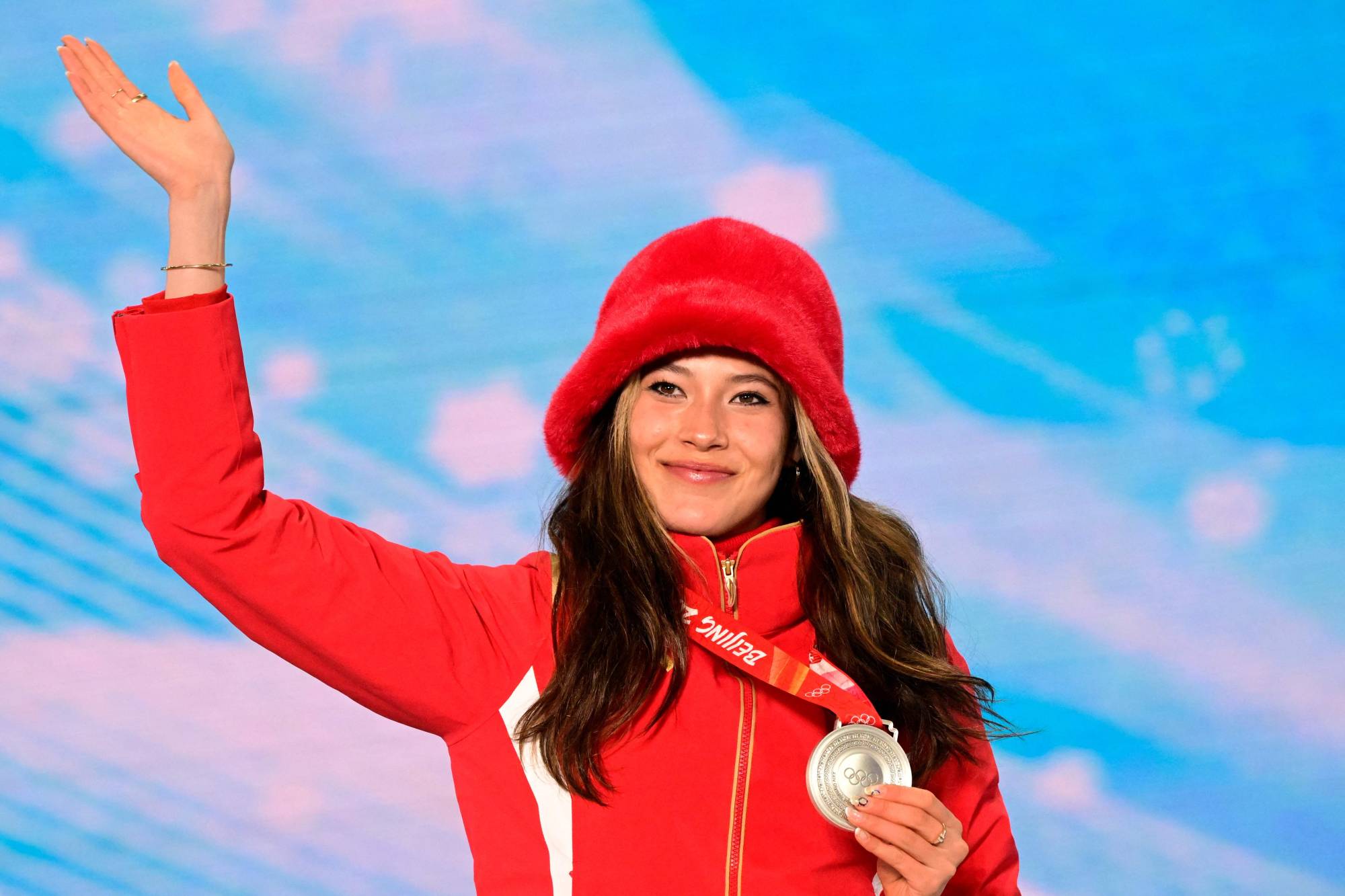 American-born silver medalist Eileen Gu, representing China, celebrates on the podium during an awards ceremony for the women’s freeski slopestyle final at the Beijing 2022 Winter Olympics in Zhangjiakou, China, on Tuesday.  | AFP-JIJI