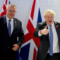 Australian Prime Minister Scott Morrison (left) and British Prime Minister Boris Johnson prior to a bilateral meeting on the sidelines of the G20 summit in Rome on Oct. 30. | REUTERS