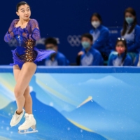 Kaori Sakamoto performs a jump during the women\'s figure skating competition at the Beijing Olympics on Thursday. Sakamoto finished third to claim the bronze medal.  | AFP-JIJI