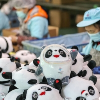 The popularity of Beijing 2022 mascot Bing Dwen Dwen sparked a run on merchandise, leading to shortages across China. | AFP-JIJI