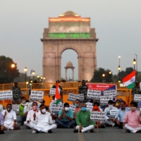 Demonstrators in New Delhi protest in June 2020 against China after a deadly border clash with Chinese troops in India’s Ladakh region. With the U.S.’ attention focused on a possible Russian invasion of Ukraine, a bigger military buildup that is taking place along the China-India border is being ignored. | REUTERS