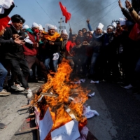 Demonstrators protest against U.S-funded infrastructure projects in Kathmandu on Friday. | REUTERS 