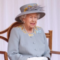 Britain\'s Queen Elizabeth II watches a military ceremony on June 12, 2021, to mark her official birthday at Windsor Castle. | AFP-JIJI
