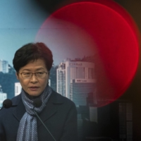 Carrie Lam, Hong Kong\'s chief executive, speaks during a news conference on Friday. Hong Kong will delay the chief executive\'s election by more than a month, the city\'s leader said, citing the need to prioritize battling the city\'s worst-ever outbreak of COVID-19. | BLOOMBERG