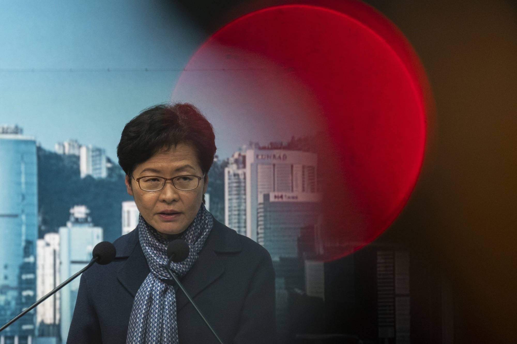 Carrie Lam, Hong Kong's chief executive, speaks during a news conference on Friday. Hong Kong will delay the chief executive's election by more than a month, the city's leader said, citing the need to prioritize battling the city's worst-ever outbreak of COVID-19. | Bloomberg