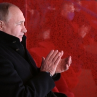 Russian President Vladimir Putin applauds during the opening ceremony of the 2022 Beijing Olympic Winter Games on Feb. 4.  | REUTERS 