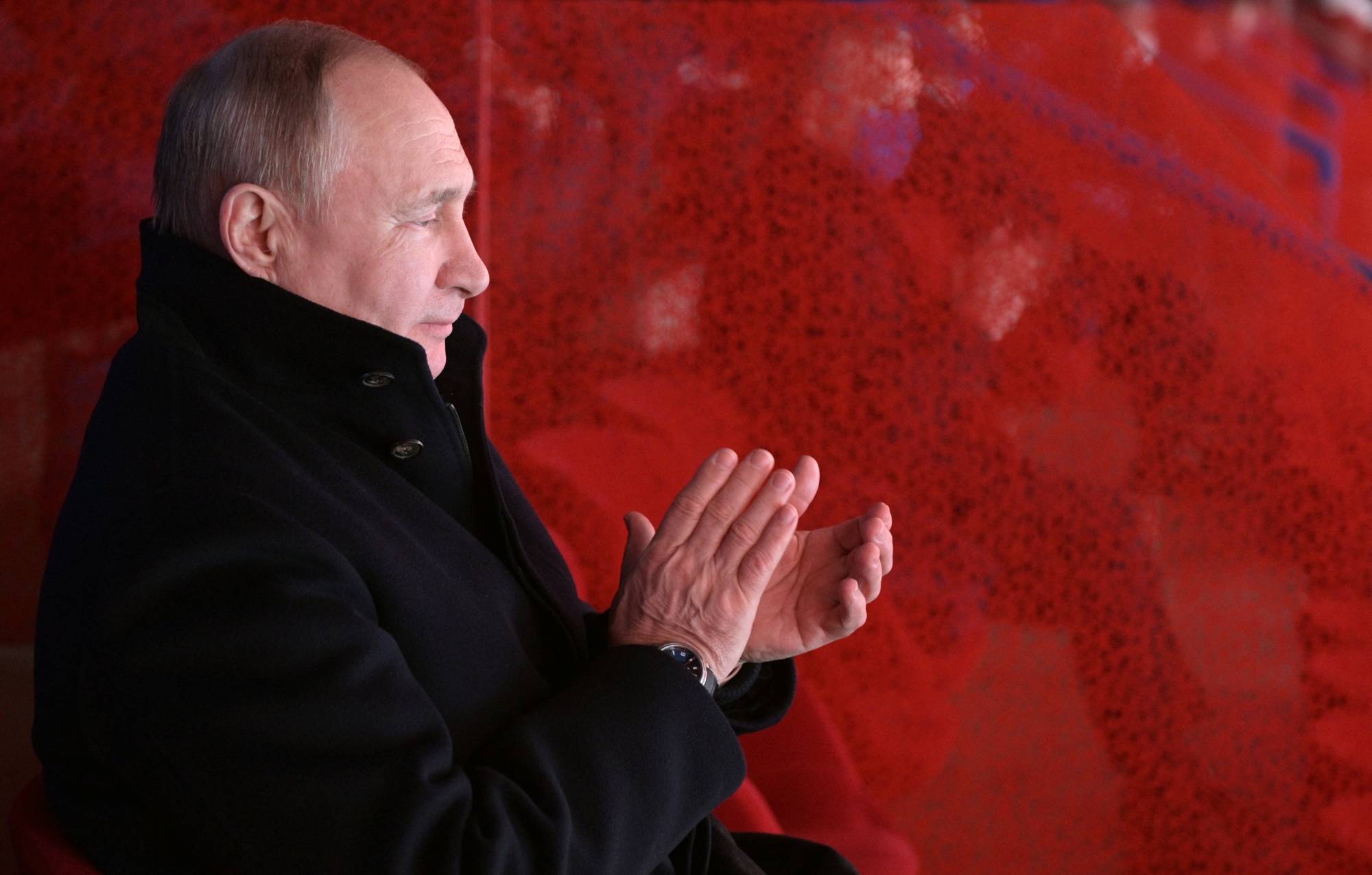 Russian President Vladimir Putin applauds during the opening ceremony of the 2022 Beijing Olympic Winter Games on Feb. 4. | REUTERS 