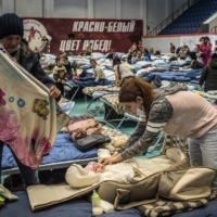 Refugees from the separatist-held territories of eastern Ukraine at a temporary refugee shelter in Taganrog, Russia, on Sunday | SERGEY PONOMAREV / THE NEW YORK TIMES