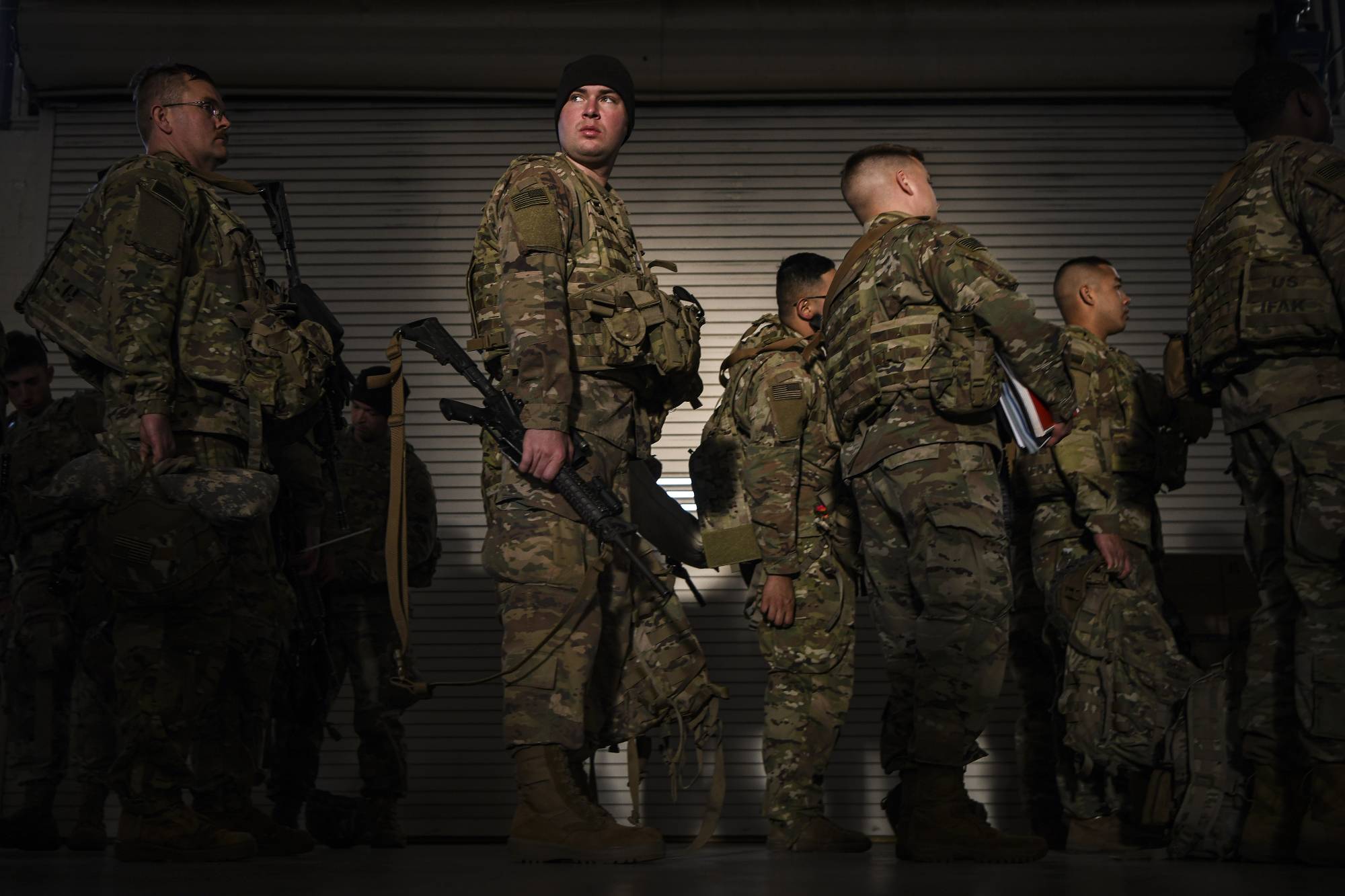 U.S. Army soldiers before their deployment to Eastern Europe, at Fort Bragg, North Carolina, on Feb. 14. Nearly 5,000 soldiers from the 82nd Airborne Division are now in Poland in response to the Russian deployments on Ukraine's borders. | Kenny Holston / The New York Times