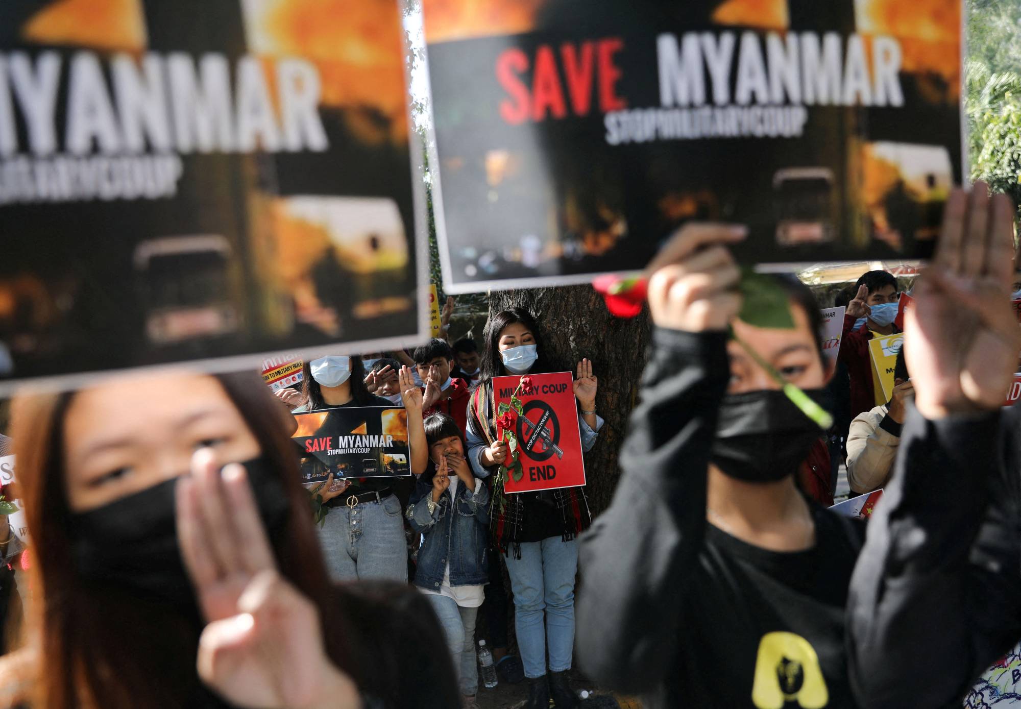 Myanmar citizens living in India attend a protest against the military coup in Myanmar in New Delhi on Tuesday. | Reuters 