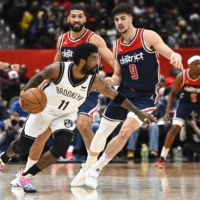 Nets guard Kyrie Irving (left) has only been allowed to play road games this season due to New York\'s COVID-19 vaccine mandate. | USA TODAY / VIA REUTERS