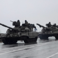 Ukrainian tanks move into the city of Mariupol on Thursday after Russian President Vladimir Putin authorized his military to move into eastern Ukraine.    | REUTERS