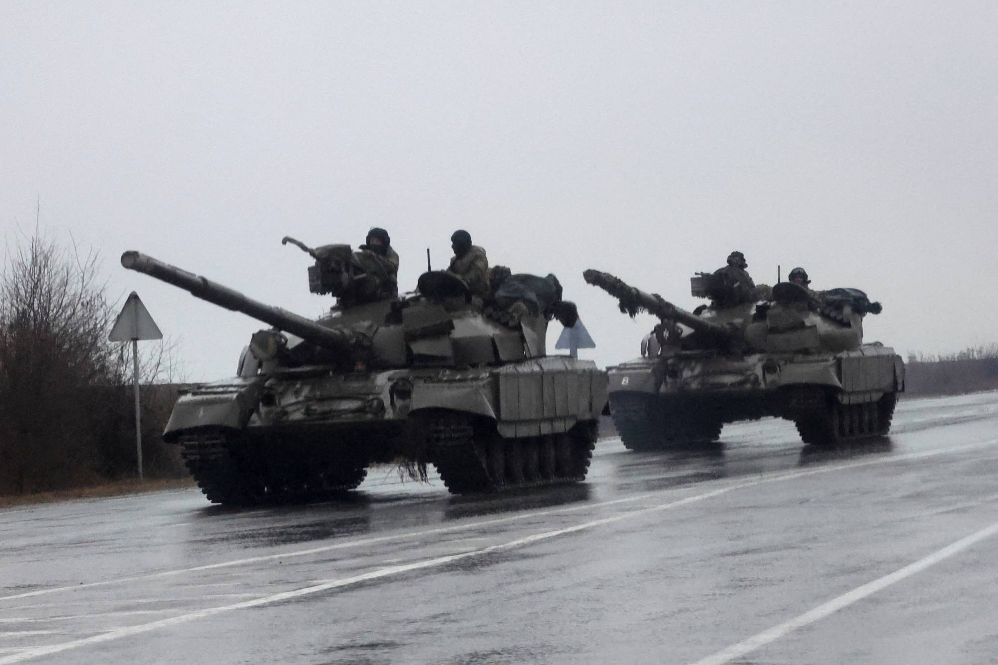 Ukrainian tanks move into the city of Mariupol on Thursday after Russian President Vladimir Putin authorized his military to move into eastern Ukraine.    | REUTERS