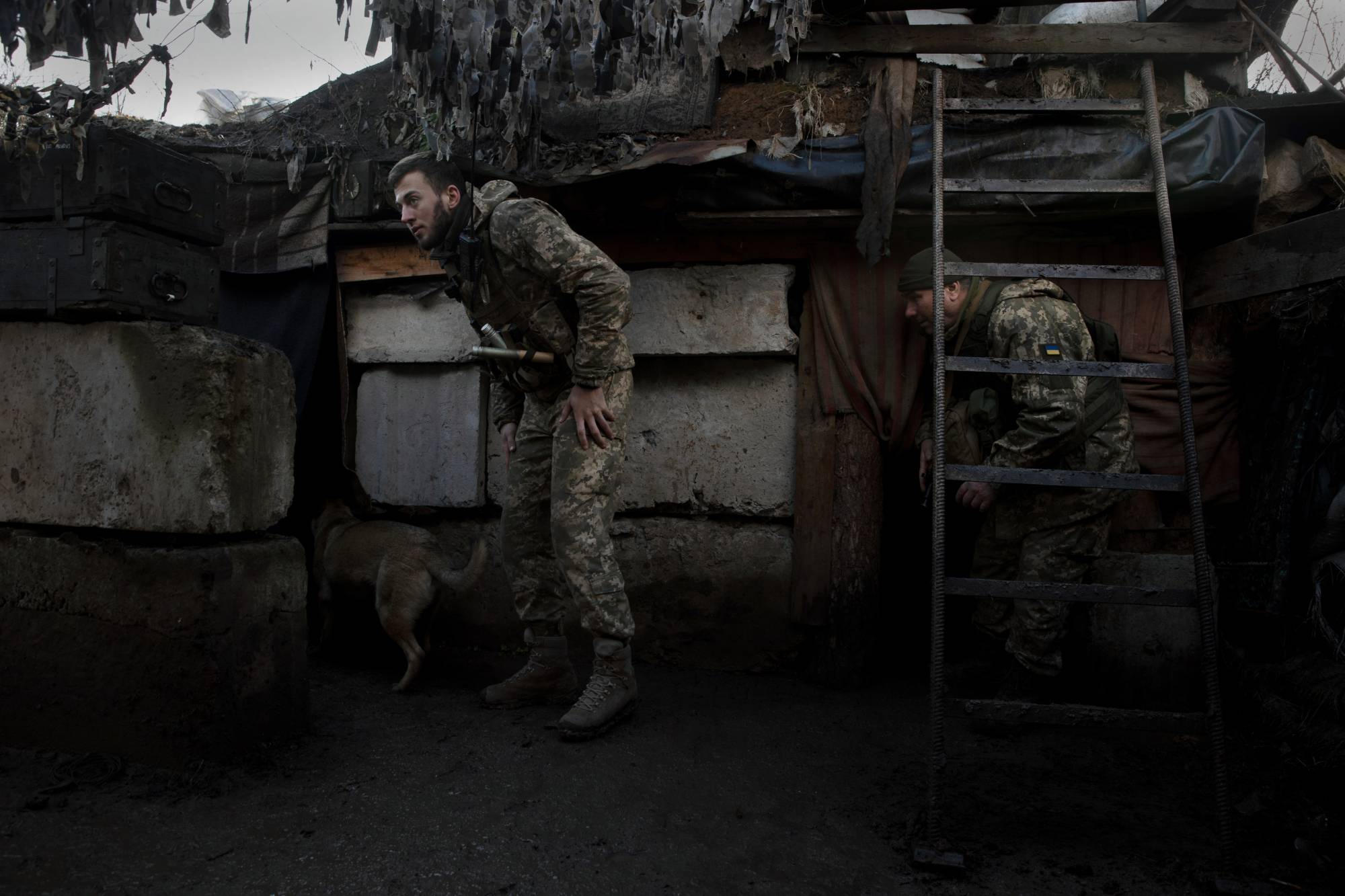 Ukrainian soldiers react to explosions in Zaitseve, Ukraine, on Wednesday. | Tyler Hicks / The New York Times
