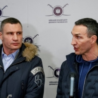 Wladimir Klitschko (left) and Vitali Klitschko speak during the opening of the first Ukrainian Territorial Defense Forces recruitment center in Kiev on Feb. 2. | REUTERS