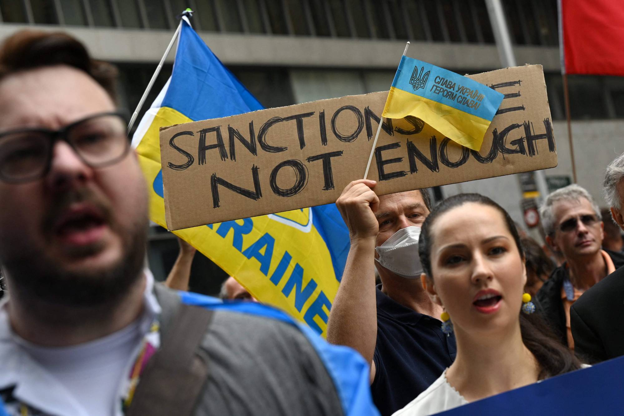 Protesters demonstrate against the Russian invasion of Ukraine in Sydney on Friday. | AFP-JIJI