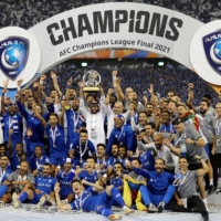 Al Hilal celebrates with the trophy after winning the Asian Champions League title in Riyadh on Nov. 23, 2021.  | REUTERS