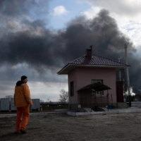 Smoke rises from the Luhansk power station in Shchastia, in eastern Ukraine, after it was heavily bombed on Tuesday. | TYLER HICKS/THE NEW YORK TIMES