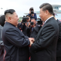 North Korean leader Kim Jong Un shakes hands with Chinese President Xi Jinping during Xi\'s visit in Pyongyang in this picture released in June 2019.    | KCNA / VIA REUTERS