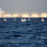 A liquefied natural gas tanker is tugged toward a thermal power station in Futtsu, Chiba Prefecture. Japan is discussing with the European Union about coordinating further diversion of part of its LNG imports to Europe, government sources said Saturday. | REUTERS