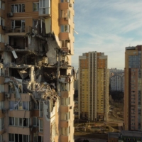 Damage from an apparent Russian missile is seen to the upper floors of a high-rise building in Kyiv on Saturday. | AFP-JIJI