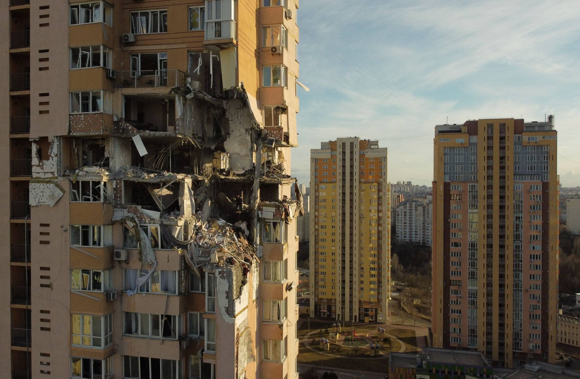 Damage from an apparent Russian missile is seen to the upper floors of a high-rise building in Kyiv on Saturday. | AFP-JIJI