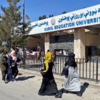 Female students walk toward the Kabul Education University on Saturday.  | REUTERS