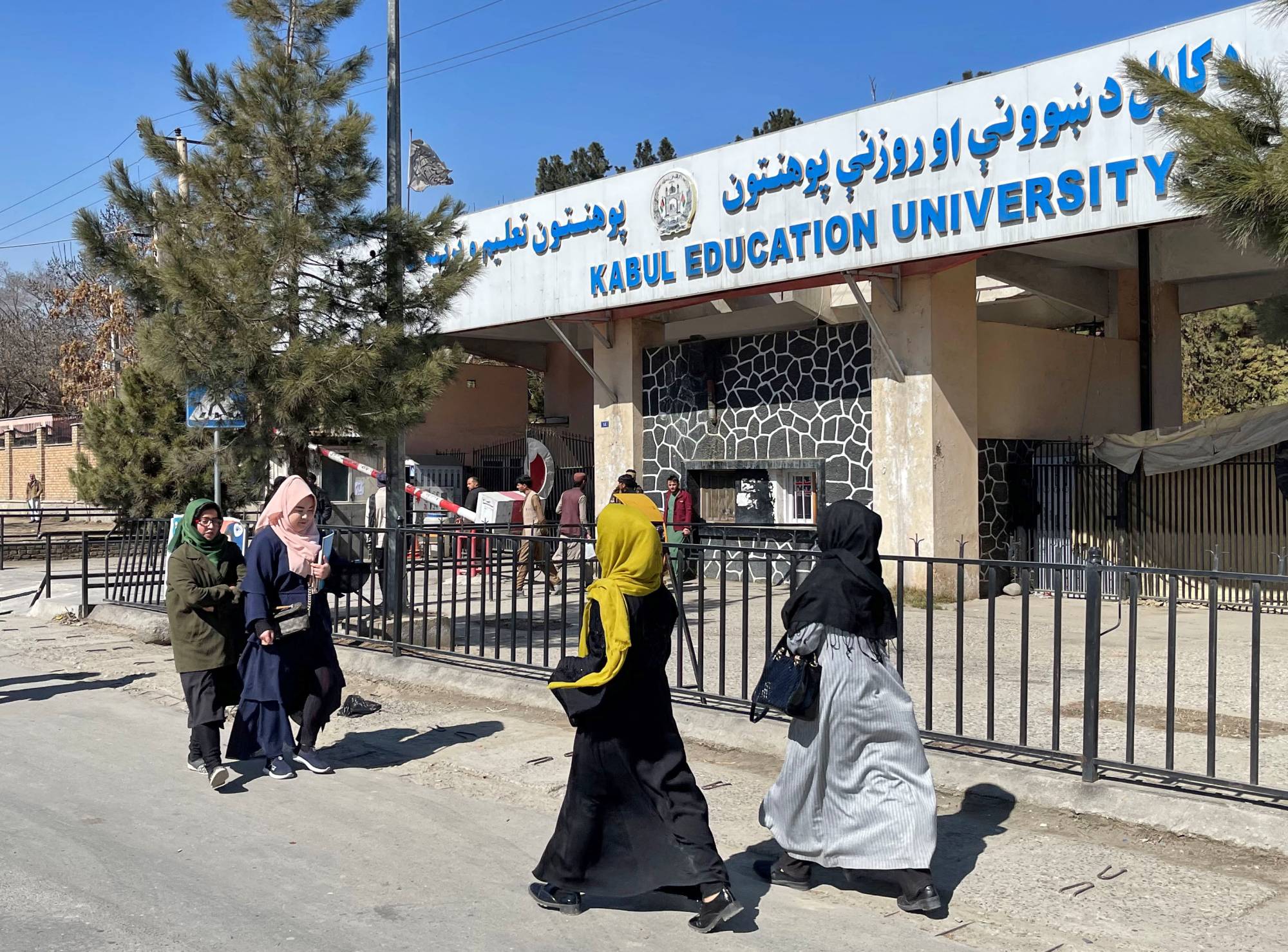 Female students walk toward the Kabul Education University on Saturday.  | REUTERS