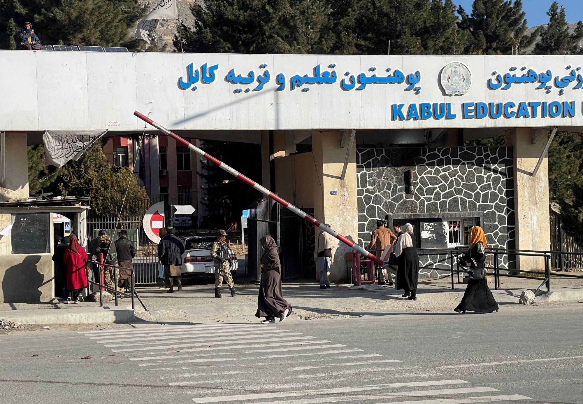 Female students enter the Kabul Education University in Kabul on Saturday.  | REUTERS
