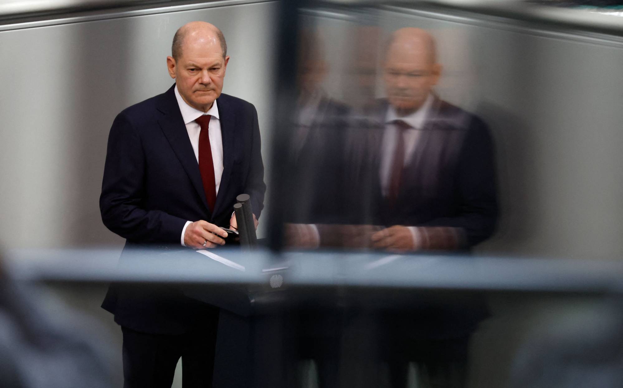 German Chancellor Olaf Scholz speaks during an extraordinary session of the lower house of parliament on Sunday in Berlin. | AFP-JIJI