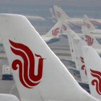 Air China flights parked on the tarmac of Beijing Capital International Airport in March, 2016. Asian carriers that have had a slower recovery from the pandemic than rivals elsewhere in the world. | REUTERS