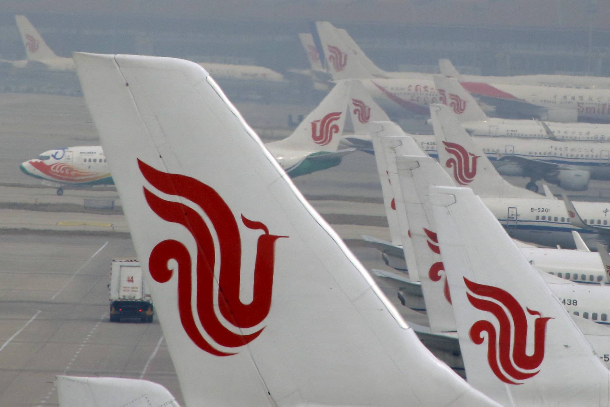 Air China flights parked on the tarmac of Beijing Capital International Airport in March, 2016. Asian carriers that have had a slower recovery from the pandemic than rivals elsewhere in the world. | REUTERS
