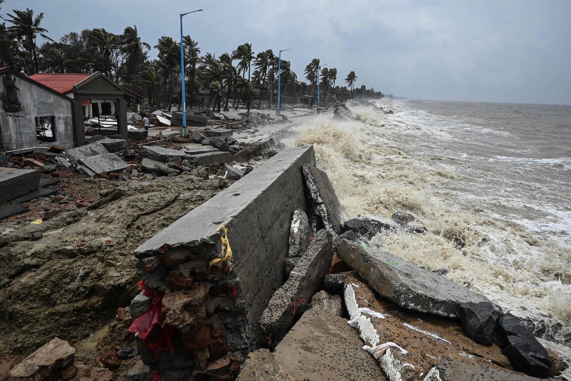 Waves lash over onto a damaged shoreline in May 2021 after Cyclone Yaas hit India's eastern coast in the Bay of Bengal, at a beach in Shankarpur. | AFP-JIJI