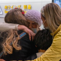 Ukrainian Maria Dovbash hugs her family in an emotional reunion Friday at Narita Airport after she traveled six days from her home in Zaporizhzhia in southern Ukraine to Japan. | OSCAR BOYD