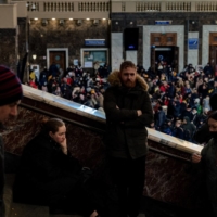 People wait to evacuate from Kyiv via rail at the Ukrainian capital\'s central train station on Monday. | AFP-JIJI