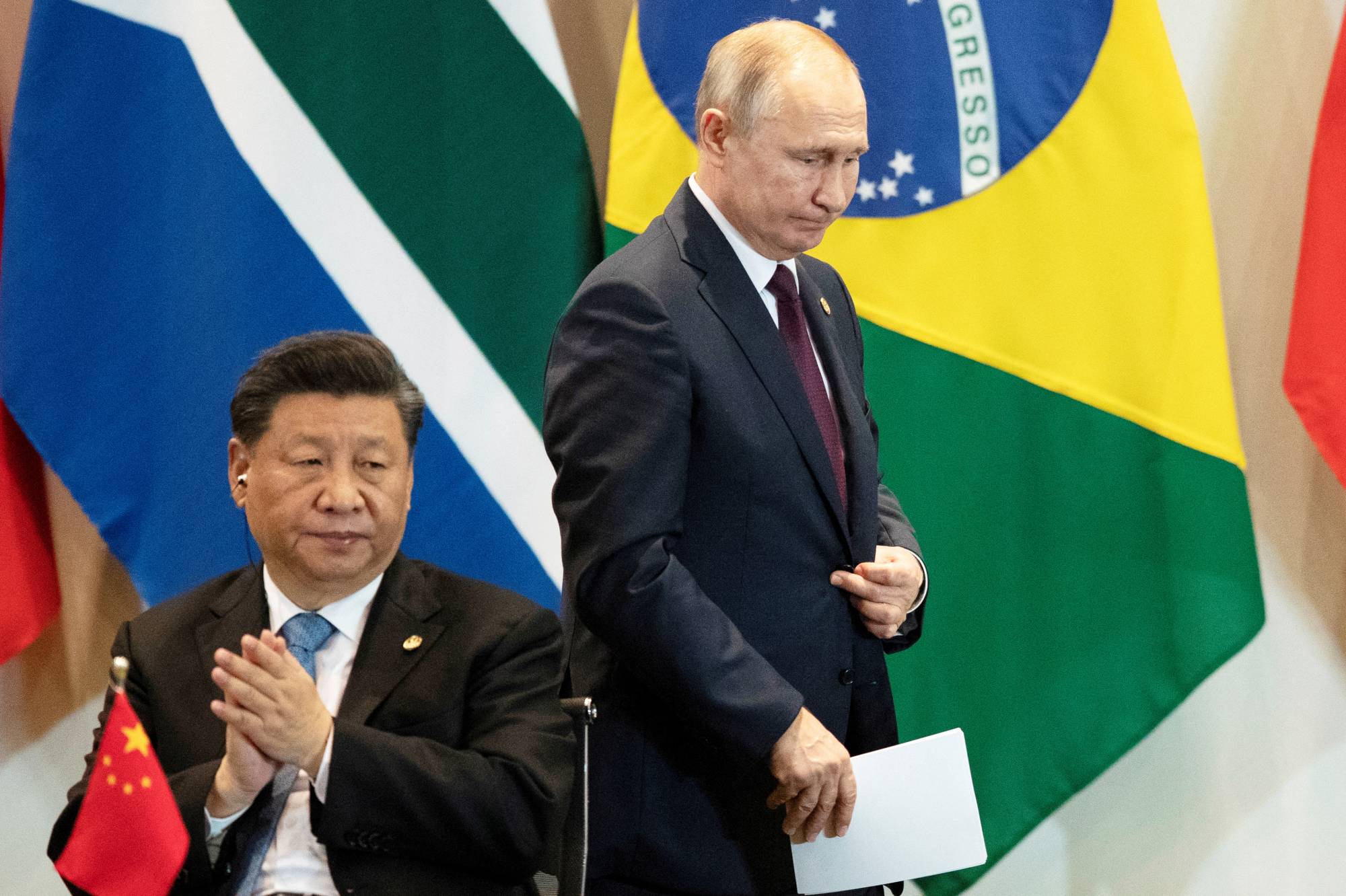 China's President Xi Jinping, left, and Russia's President Vladimir Putin during the BRICS emerging economies meeting in Brasilia, Brazil Nov., 2019. | REUTERS