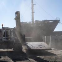 A forklift carried steel sheets at a port in Mykolaiv, Ukraine, last month. The Russian invasion is disrupting global supply chains. | BRENDAN HOFFMAN / THE NEW YORK TIMES