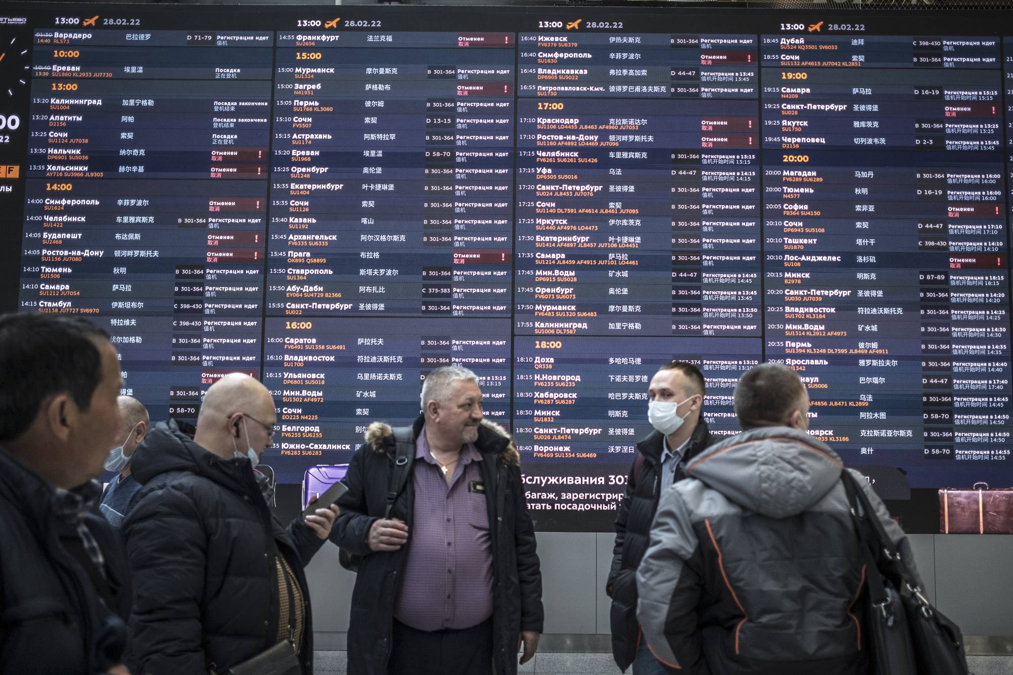 The departures board displayed flight cancellations at Sheremetyevo Airport in Moscow on Monday. | Sergey Ponomarev / The New York Times