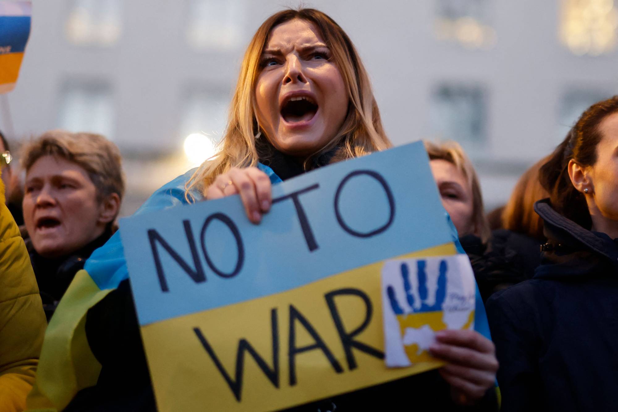 Demonstrators protest Russia's invasion of Ukraine during a rally in London on Feb. 25.  | AFP-JIJI